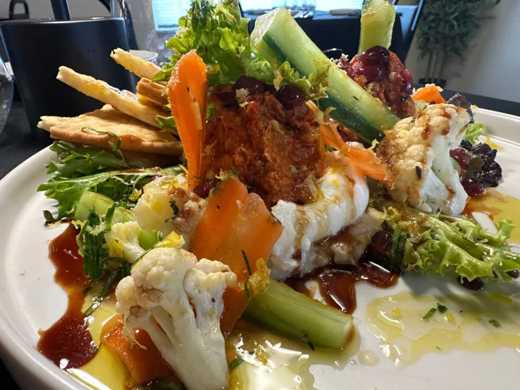 Mediterranean burrata mezze with flatbread, roasted pepper spread and vegetables